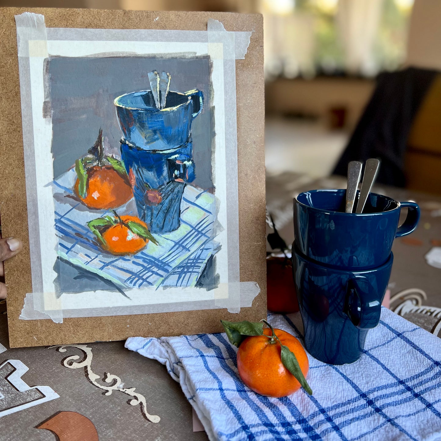 Coffee mugs and oranges in gouache