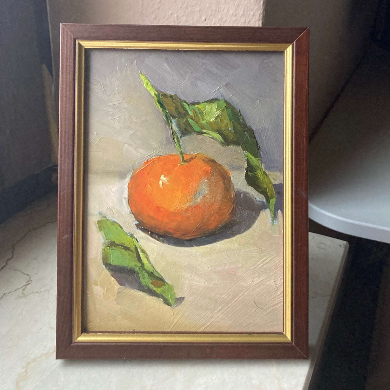 Small Stilllife Painting - Clementine with leaves